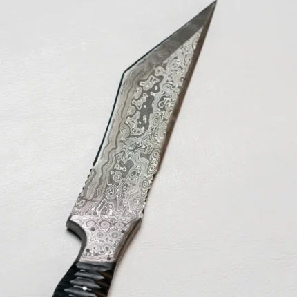 Handmade Damascus Steel Hunting Knife with 12-inch Blade and Ergonomic Handle, Featuring a Leather Sheath for Outdoor and Survival Use.